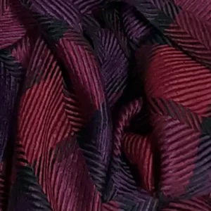 Close up handwoven Tencel scarf in rich shades of dark purple, black, and deep red, woven in a 3/1 twill for a soft, silky drape. Versatile as a cozy scarf or an elegant wrap."